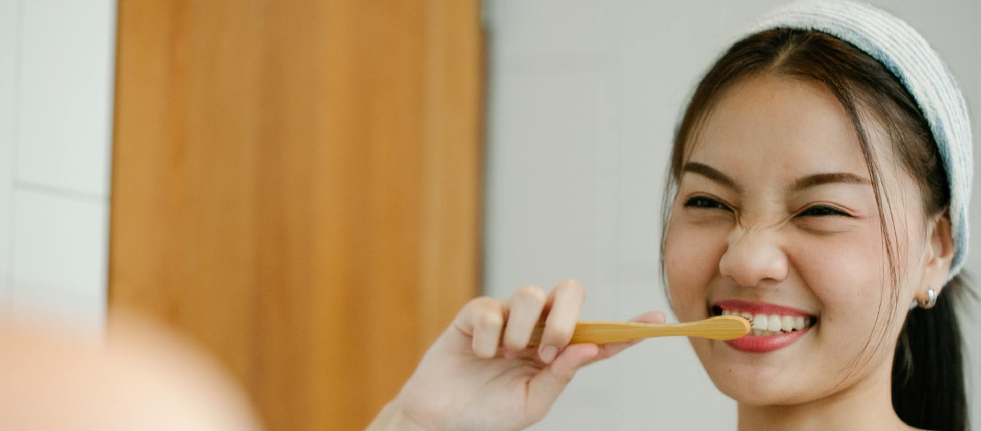 woman brushing teeth
